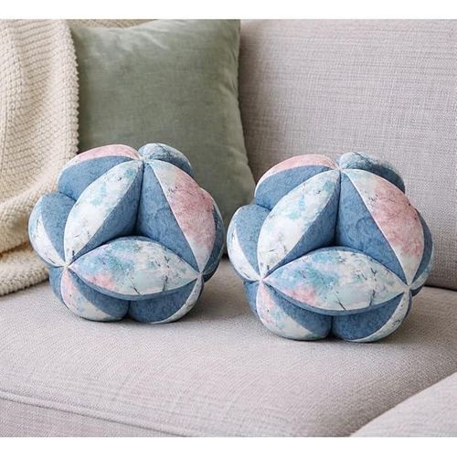 A pair of decorative balls in a denim color with multiple accents – soft velvet fabric