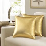 وسادتان دبل فيس ، جلد ذهبي *قماش بيج  –  مقاس 40*40 سم.